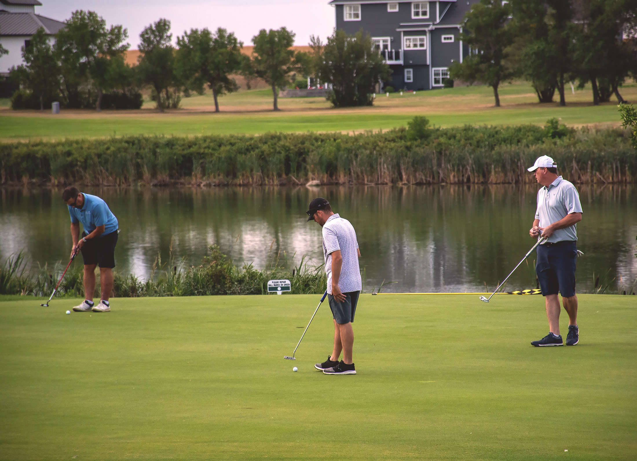 3 men on a golf course