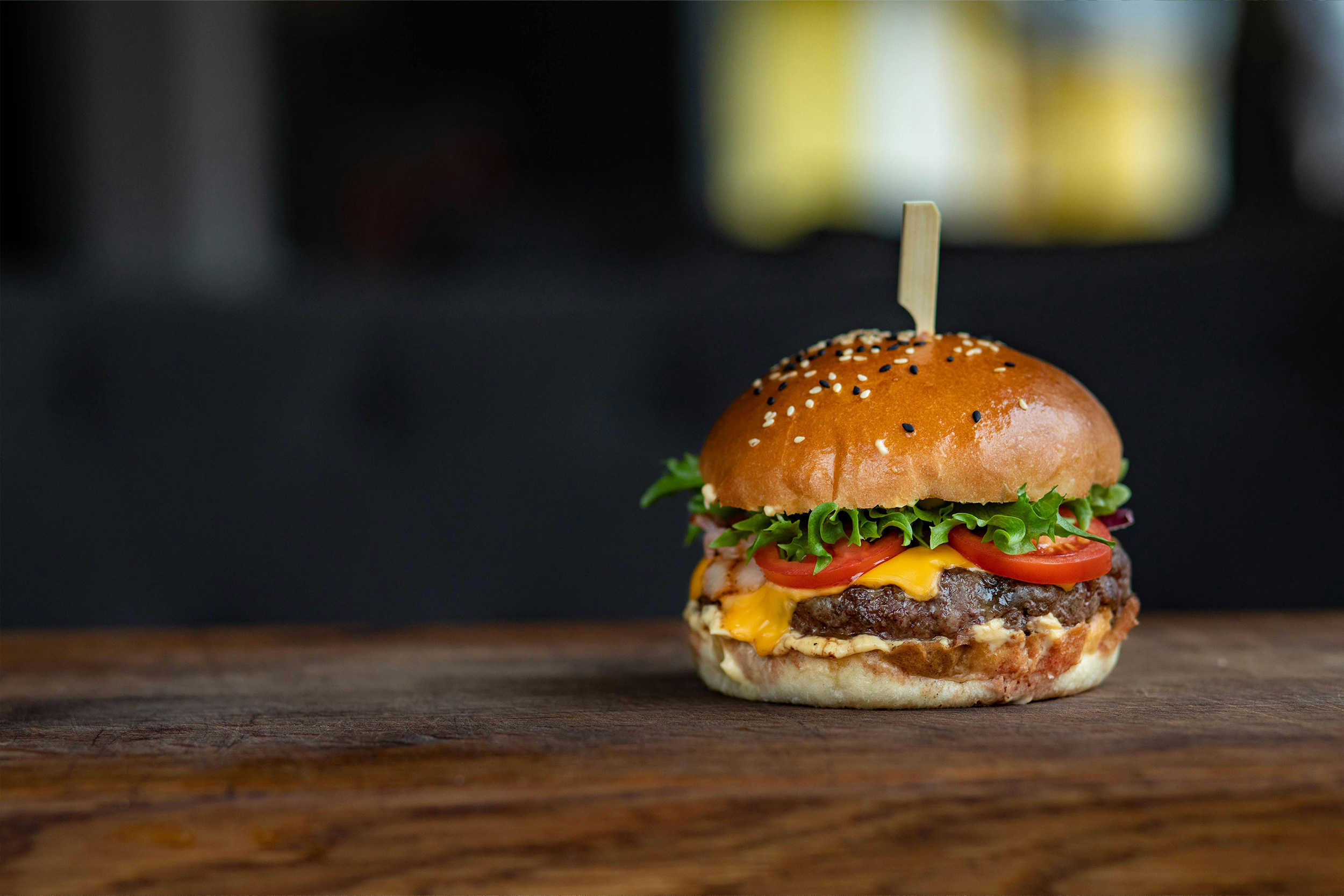 A close up image of a cheeseburger